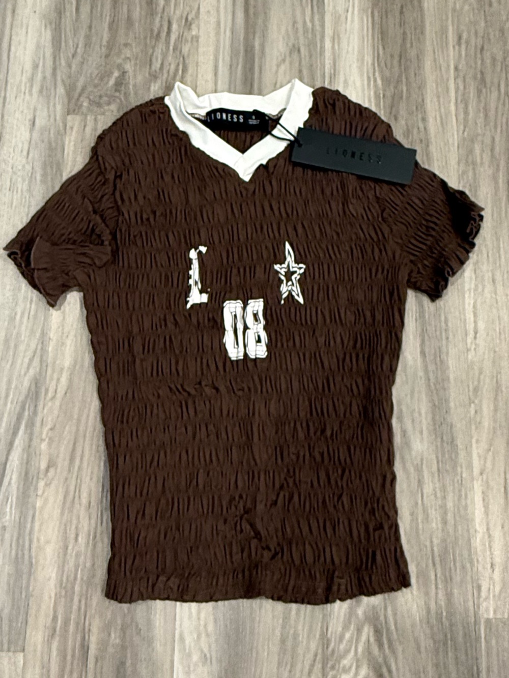 Lioness Brown Top with White Trim
